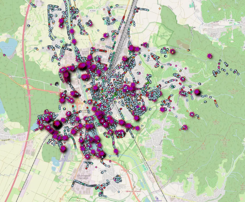Ein Stadtplan, der mit lila und rosafarbenen Starburst-Markern und blauen sechseckigen Markern überlagert ist, die dichte Punkte von Interesse und Aktivitäten in der Stadt und im Umland anzeigen.