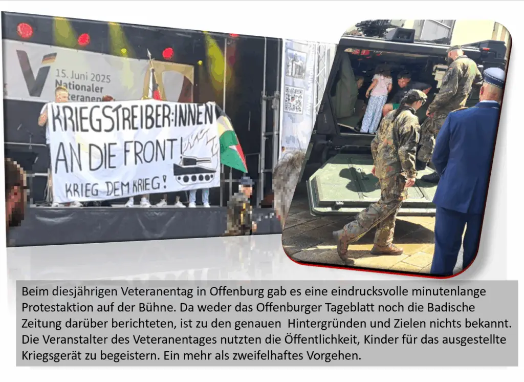 Ein Protesttransparent mit der Aufschrift KRIEGSTREIBER:INNEN AN DIE FRONT! KRIEG DEM KRIEG! wird auf der Bühne gezeigt. In der Nähe helfen Soldaten Kindern beim Einsteigen in ein Militärfahrzeug auf der Offenburger Veteranentagsveranstaltung.